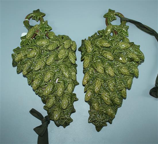 Pair of Rye Pottery wall pockets, relief-applied with hops